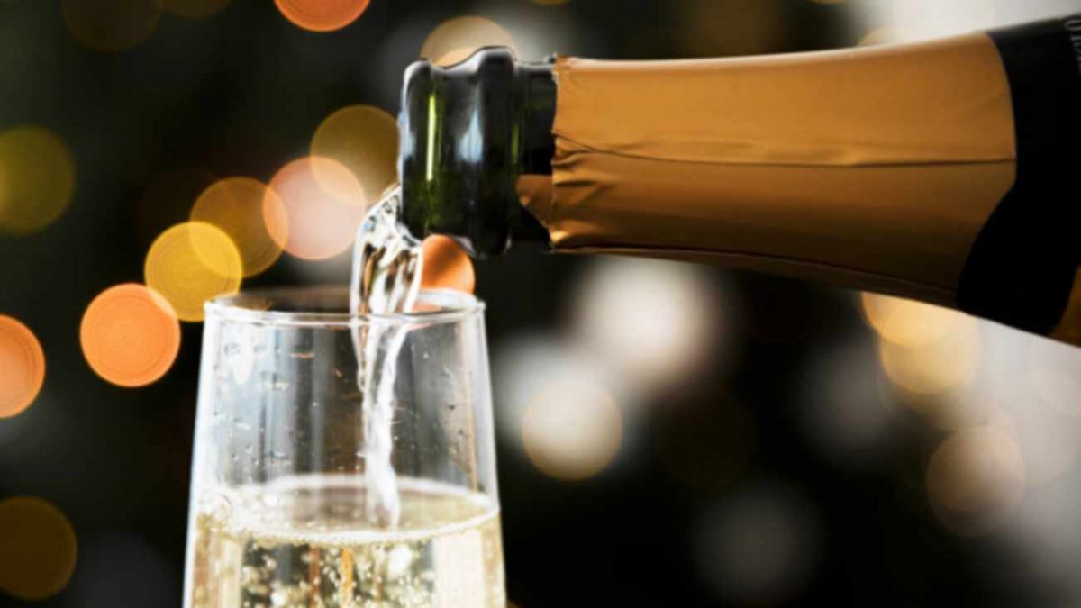 spumante avanzato da natale tre pouring champagne glass before new year 23 2147981614